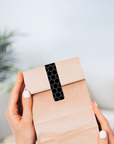Gewaehrverschluss_Etiketten_fuer_Tueten_aus_Kraftpapier_mit_Wabenmuster_schwarz_70_x_12_mm_ID4187