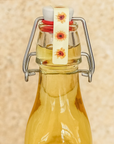 Verschlussetiketten_fuer_Buegelflaschen_mit_Sonnenblumen_70_x_12_mm_von_watsonlabel